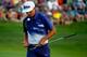 LOUISVILLE, KY - AUGUST 09: Rickie Fowler of the United States walks across the18th green during the third round of the 96th PGA Championship at Valhalla Golf Club on August 9, 2014 in Louisville, Kentucky. (Photo by Sam Greenwood/Getty Images)