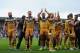LEIGH, ENGLAND - AUGUST 10: Castleford Tigers celebrate at full-time following the Tetley's Challenge Cup Semi Final match between Widnes Vikings and Castleford Tigers at Leigh Sports Village on August 10, 2014 in Leigh, England. (Photo by Chris Brunskill