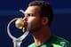 Jo-Wilfried Tsonga kisses his trophy after winning the 2014 Rogers Cup.
