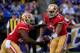 BALTIMORE, MD - AUGUST 07: Quarterback Colin Kaepernick #7 of the San Francisco 49ers hands the ball off to running back Carlos Hyde #28 during the first half of an NFL pre-season game against the Baltimore Ravens at M&T Bank Stadium on August 7, 2014 in
