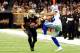 NEW ORLEANS, LA - NOVEMBER 10: Orlando Scandrick #32 of the Dallas Cowboys tries to tackle Pierre Thomas #23 of the New Orleans Saints during a game at the Mercedes-Benz Superdome on November 10, 2013 in New Orleans, Louisiana. (Photo by Stacy Revere/Ge