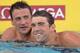 IRVINE, CA - AUGUST 08: Michael Phelps and Ryan Lochte react after their swims in the Men's 100 Meter Butterfly Final during the 2014 Phillips 66 National Championships at the Woollett Aquatic Center on August 8, 2014 in Irvine, California. (Photo by Ha