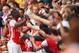 LONDON, ENGLAND - AUGUST 02: Yaya Sanogo of Arsenal celebrates scoring his 4th goal with fans during the Emirates Cup match between Arsenal and Benfica at the Emirates Stadium on August 2, 2014 in London, England. (Photo by Michael Regan/Getty Images)