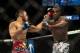 Jan 15, 2014; Duluth, GA, USA; Lorenz Larkin (red gloves) fights Brad Tavares (blue gloves) during UFC Fight Night at Gwinnett Center. Mandatory Credit: Joshua S. Kelly-USA TODAY Sports