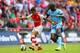 LONDON, ENGLAND - AUGUST 10: Alexis Sanchez of Arsenal in action against Yaya Toure of Manchester City during the FA Community Shield match between Manchester City and Arsenal at Wembley Stadium on August 10, 2014 in London, England. (Photo by Clive Maso