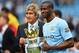 MANCHESTER, ENGLAND - MAY 11: The Manchester City Manager Manuel Pellegrini and Yaya Toure pose with the trophy at the end of the Barclays Premier League match between Manchester City and West Ham United at the Etihad Stadium on May 11, 2014 in Mancheste