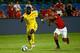 MIAMI GARDENS, FL - AUGUST 04: Kolo Toure #4 of Liverpool is challenged by Nani #17 of Manchester United in the Guinness International Champions Cup 2014 Final at Sun Life Stadium on August 4, 2014 in Miami Gardens, Florida. (Photo by Chris Trotman/Getty