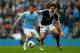 MANCHESTER, ENGLAND - APRIL 05: David Silva of Manchester City is challenged by Jack Cork of Southampton during the Barclays Premier League match between Manchester City and Southampton at Etihad Stadium on April 5, 2014 in Manchester, England. (Photo b