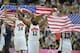 Aug 11, 2012; London, United Kingdom; USA forward Anthony Davis (14) and guard James Harden (12) and guard Chris Paul (13) hold up flags after winning the gold in the men's basketball final against Spain in the London 2012 Olympic Games at North Greenwich