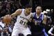 SAN ANTONIO, TX - APRIL 23: Tim Duncan #21 of the San Antonio Spurs drives against Shawn Marion #0 of the Dallas Mavericks in Game Two of the Western Conference Quarterfinals during the 2014 NBA Playoffs at the AT&T Center on April 23, 2014 in San Antoni