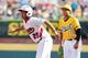 Aug 25, 2013; Williamsport, PA, USA; Japan Kyousuke Kobayashi (25) takes a lead off of first base during the third inning against California (West) during the Little League World Series Championship game at Lamade Stadium. Mandatory Credit: Matthew O'Hare