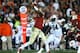 PASADENA, CA - JANUARY 06: Quarterback Jameis Winston #5 of the Florida State Seminoles passes the ball in the fourth quarter as defensive end Nosa Eguae #94 of the Auburn Tigers rushes in during the 2014 Vizio BCS National Championship Game at the Rose