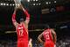 OAKLAND, CA - DECEMBER 13: James Harden #13 with Dwight Howard #12 of the Houston Rockets hangs from the net during a game against the Golden State Warriors on December 13, 2013 at Oracle Arena in Oakland, California. NOTE TO USER: User expressly acknowle
