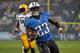 NASHVILLE, TN - AUGUST 09: Running back Shonn Greene #23 of the Tennessee Titans rushes for a touchdown against the Green Bay Packers at LP Field on August 9, 2014 in Nashville, Tennessee. (Photo by Frederick Breedon/Getty Images)
