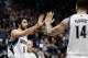 MINNEAPOLIS, MN - OCTOBER 30: Ricky Rubio #9 and Nikola Pekovic #14 of the Minnesota Timberwolves celebrate a play during the game against the Orlando Magic on October 30, 2013 at Target Center in Minneapolis, Minnesota. NOTE TO USER: User expressly ackno