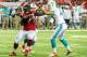 ATLANTA, GA - AUGUST 08: Ra'Shede Hageman #77 of the Atlanta Falcons pushes past Brett Brackett #40 of the Miami Dolphins in the fourth quarter of a preseason game at the Georgia Dome on August 8, 2014 in Atlanta, Georgia. The Falcons won 16-10. (Photo by