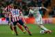 MADRID, SPAIN - FEBRUARY 05: Angel Di Maria (R) of Real Madrid CF competes for the ball with Juan Francisco Torres alias Juanfran (2ndR) of Atletico de Madrid and his team mate Jose Sosa during the Copa del Rey semifinal first leg match between Real Madri