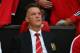 MANCHESTER, ENGLAND - AUGUST 12: Manchester United manager Louis Van Gaal sits on the team bench as he makes his home debut during the Pre Season Friendly match between Manchester United and Valencia at Old Trafford on August 12, 2014 in Manchester, Engl