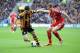 HULL, ENGLAND - MARCH 22: Shane Long of Hull City tackled by Craig Dawson of West Bromwich Albion during the Barclays Premier League match between Hull City and West Bromwich Albion at KC Stadium on March 22, 2014 in Hull, England. (Photo by Tony Marshal