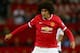 MANCHESTER, ENGLAND - AUGUST 12: Marouane Fellaini of Manchester United in action during the Pre Season Friendly match between Manchester United and Valencia at Old Trafford on August 12, 2014 in Manchester, England. (Photo by Clive Brunskill/Getty Imag