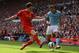 LIVERPOOL, ENGLAND - AUGUST 26: Aleksandar Kolarov of Manchester City competes with Martin Kelly of Liverpool during the Barclays Premier League match between Liverpool and Manchester City at Anfield on August 26, 2012 in Liverpool, England. (Photo by M