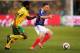 BLOEMFONTEIN, SOUTH AFRICA - JUNE 22: MacBeth Sibaya of South Africa challenges Franck Ribery of France during the 2010 FIFA World Cup South Africa Group A match between France and South Africa at the Free State Stadium on June 22, 2010 in Mangaung/Bloemf