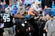 CHARLOTTE, NC - DECEMBER 22: Jimmy Graham #80 of the New Orleans Saints makes a catch as Charles Johnson #95 of the Carolina Panthers looks on during their game at Bank of America Stadium on December 22, 2013 in Charlotte, North Carolina. The Panthers wo