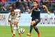 TORONTO, ON - JULY 24: Giampaolo Pazzini #11 of AC Milan chases the ball against Kostas Manolas #24 of Olympiacos FC during International Champions Cup 2014 action at BMO Field July 24, 2014 in Toronto, Ontario, Canada. (Photo by Abelimages/Getty Images)