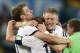 Bayern players Thomas Muller, Philipp Lahm and Bastian Schweinsteiger celebrate their World Cup win.
