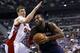 Apr 13, 2014; Auburn Hills, MI, USA; Detroit Pistons forward Greg Monroe (10) dribbles around Toronto Raptors forward Tyler Hansbrough (50) in the fourth quarter at The Palace of Auburn Hills. Mandatory Credit: Rick Osentoski-USA TODAY Sports