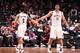 NEW YORK, NY - DECEMBER 18: Deron Williams #8 of the Brooklyn Nets high fives teammate Brook Lopez #11 during a game against the Washington Wizards at the Barclays Center on December 18, 2013 in the Brooklyn borough of New York City. NOTE TO USER: User