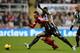 NEWCASTLE UPON TYNE, ENGLAND - NOVEMBER 30: Cheik Tiote of Newcastle United competes with Morgan Amalfitano of West Bromwich Albion during the Barclays Premier League match between Newcastle United and West Bromwich Albion at St James' Park on November 3