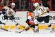 PHILADELPHIA, PA - JANUARY 25: Daniel Paille #20 of the Boston Bruins attempts a pass to teammate Carl Soderberg #34 as Steve Mason #35 of the Philadelphia Flyers defends his crease at the Wells Fargo Center on January 25, 2014 in Philadelphia, Pennsylva