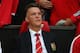 MANCHESTER, ENGLAND - AUGUST 12: Manchester United manager Louis Van Gaal sits on the team bench as he makes his home debut during the Pre Season Friendly match between Manchester United and Valencia at Old Trafford on August 12, 2014 in Manchester, Engl
