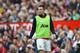 MANCHESTER, ENGLAND - MAY 03: Substitute Robin van Persie of Manchester United looks on from the touchline during the Barclays Premier League match between Manchester United and Sunderland at Old Trafford on May 3, 2014 in Manchester, England. (Photo by