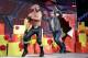 Dean Ambrose leaps out of a present to chase Seth Rollins.