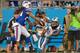 CHARLOTTE, NC - AUGUST 08: Kelvin Benjamin #13 of the Carolina Panthers makes a touchdown catch as Stephon Gilmore #24 of the Buffalo Bills defends during their game at Bank of America Stadium on August 8, 2014 in Charlotte, North Carolina. (Photo by Gr