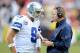 LANDOVER, MD - DECEMBER 22: Head coach Jason Garrett of the Dallas Cowboys talks with Tony Romo #9 during a timeout in the fourth quarter against the Washington Redskins at FedExField on December 22, 2013 in Landover, Maryland. Dallas won the game 24-23.
