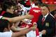 MANCHESTER, ENGLAND - AUGUST 12: Manchester United manager Louis Van Gaal signs autographs as he makes his home debut during the Pre Season Friendly match between Manchester United and Valencia at Old Trafford on August 12, 2014 in Manchester, England.