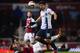 LONDON, ENGLAND - JANUARY 21: Sergio Aguero of Manchester City evades Matthew Taylor of West Ham United during the Capital One Cup Semi-Final, Second Leg match between West Ham United and Manchester City at Boleyn Ground on January 21, 2014 in London, En