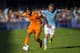VIGO, SPAIN - MAY 11: Sami Khedira of Real Madrid CF duels for the ball with Michael Krohn-Dehli of RC Celta De Vigo during the la Liga match between Real Club Celta De Vigo and Real Madrid CF at Estadio Balaidos on May 11, 2014 in Vigo, Spain. (Photo b