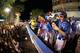 Mo'ne tosses signed baseballs to fans during the 2014 LLWS Parade.