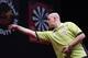DUBAI, UNITED ARAB EMIRATES - MAY 30: Michael Van Gerwen of the Netherlands plays against Peter Wright of England during the 2014 Dubai Duty Free Darts Masters Final match at Dubai Duty Free Tennis Stadium, Irish Village on May 30, 2014 in Dubai, United