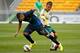 Bryan Cristante (right) tussles with Stevan Jovetic in preseason friendly