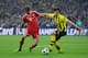 LONDON, ENGLAND - MAY 25: Thomas Mueller of Bayern Muenchen holds off Mats Hummels of Borussia Dortmund during the UEFA Champions League final match between Borussia Dortmund and FC Bayern Muenchen at Wembley Stadium on May 25, 2013 in London, United Kin