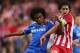 LONDON, ENGLAND - APRIL 30: Willian of Chelsea holds off Tiago of Club Atletico de Madrid during the UEFA Champions League semi-final second leg match between Chelsea and Club Atletico de Madrid at Stamford Bridge on April 30, 2014 in London, England. (