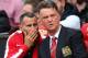 MANCHESTER, ENGLAND - AUGUST 16: Manchester United Manager Louis van Gaal speaks with Assistant Ryan Giggs (L) prior to the Barclays Premier League match between Manchester United and Swansea City at Old Trafford on August 16, 2014 in Manchester, England