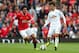MANCHESTER, ENGLAND - AUGUST 16: Marouane Fellaini of Manchester United competes with Ki Sung-Yeung of Swansea City during the Barclays Premier League match between Manchester United and Swansea City at Old Trafford on August 16, 2014 in Manchester, Engl