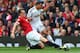 MANCHESTER, ENGLAND - AUGUST 16: Phil Jones of Manchester United tackles Jefferson Montero of Swansea City during the Barclays Premier League match between Manchester United and Swansea City at Old Trafford on August 16, 2014 in Manchester, England. (Ph