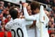 MANCHESTER, ENGLAND - AUGUST 16: Gylfi Sigurdsson of Swansea City celebrates scoring his team's second goal with his team-mates during the Barclays Premier League match between Manchester United and Swansea City at Old Trafford on August 16, 2014 in Manc